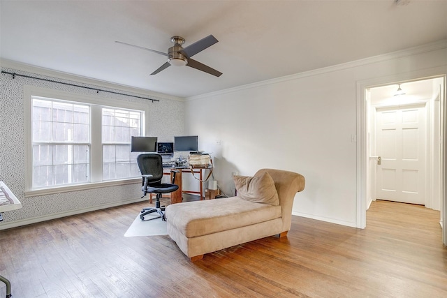 office area featuring ornamental molding, ceiling fan, wood finished floors, baseboards, and wallpapered walls