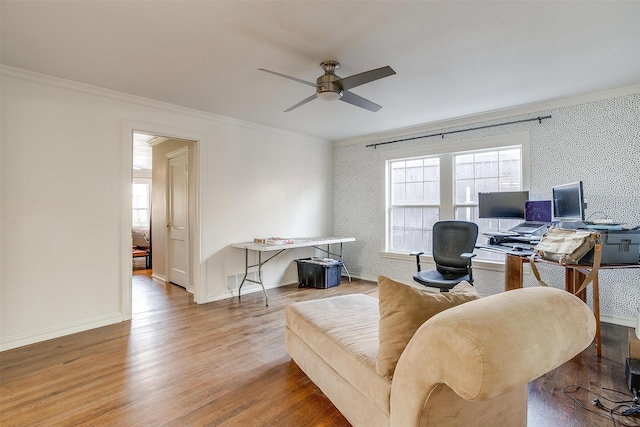 office with wallpapered walls, baseboards, crown molding, and wood finished floors