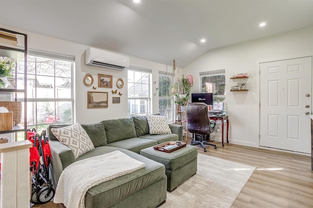 living area with a wall unit AC, lofted ceiling, recessed lighting, light wood-type flooring, and baseboards