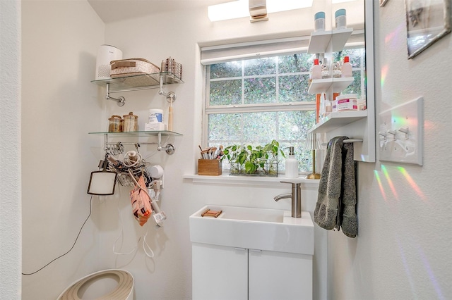 clothes washing area with a sink