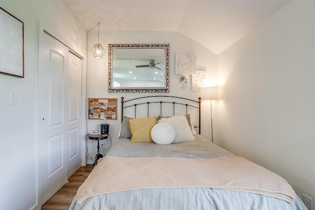 bedroom featuring vaulted ceiling and wood finished floors