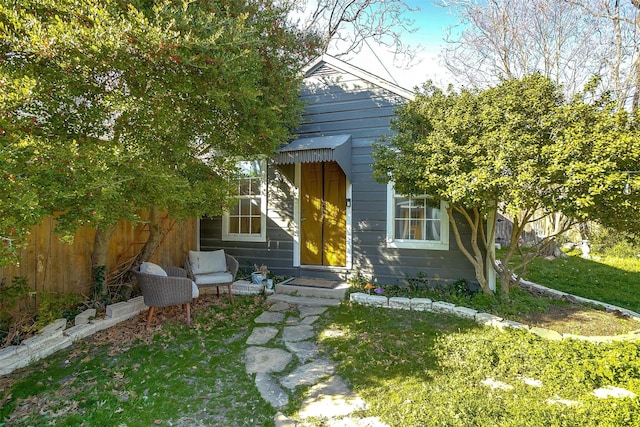 view of front of house with fence