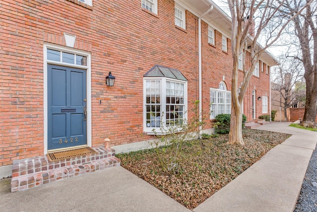 entrance to property with brick siding