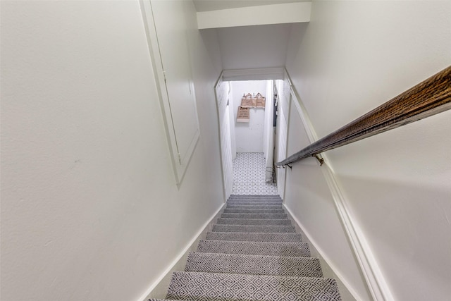 stairs featuring baseboards