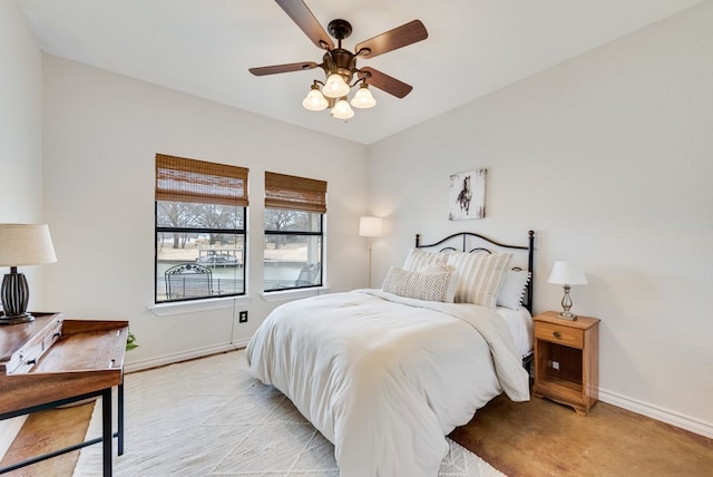 bedroom featuring ceiling fan and baseboards