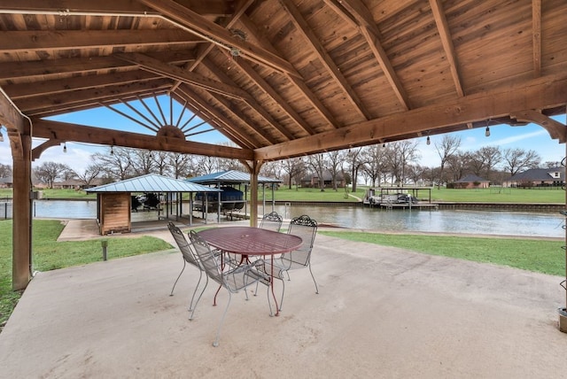 view of patio / terrace with a water view and a gazebo