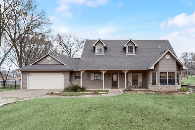 view of front of house with an attached garage, fence, concrete driveway, and a front yard