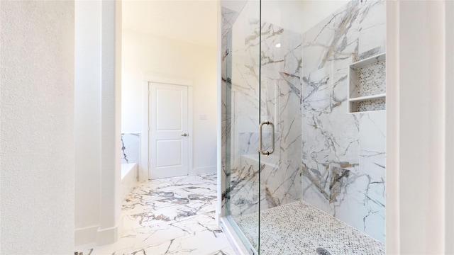 full bathroom with a garden tub, marble finish floor, and a marble finish shower