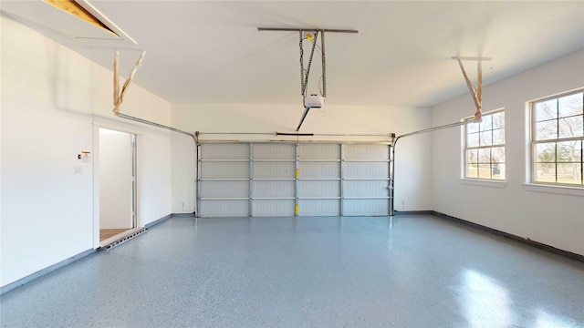 garage featuring baseboards and a garage door opener