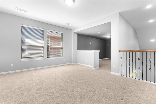 empty room with recessed lighting, baseboards, visible vents, and carpet flooring