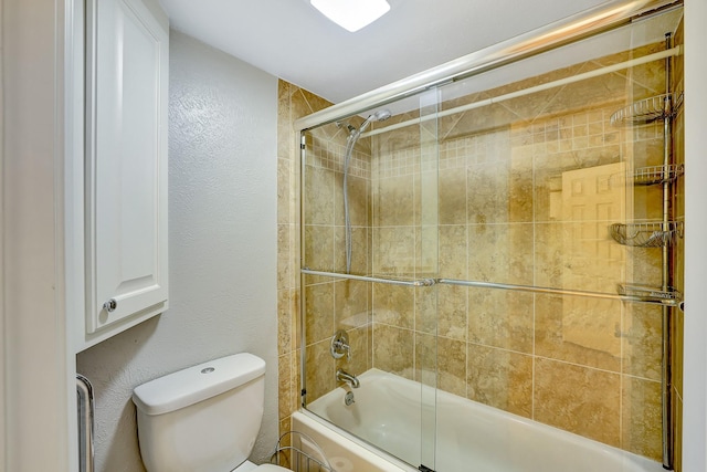 full bath with toilet, enclosed tub / shower combo, and a textured wall