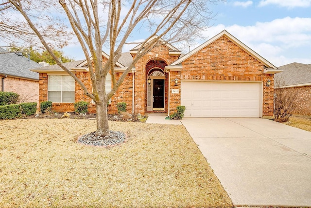 view of front of house with a garage, brick siding, driveway, and roof with shingles