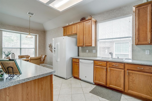 kitchen with light tile patterned floors, lofted ceiling, backsplash, a sink, and white appliances