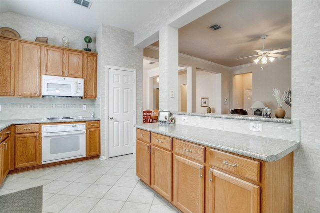 kitchen featuring light tile patterned floors, ceiling fan, white appliances, visible vents, and light countertops