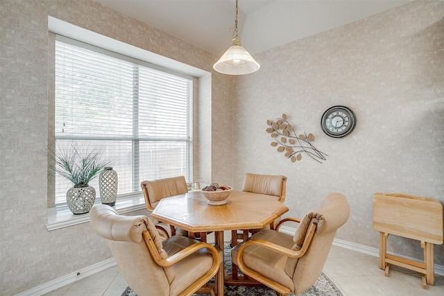 dining room with baseboards and light tile patterned floors