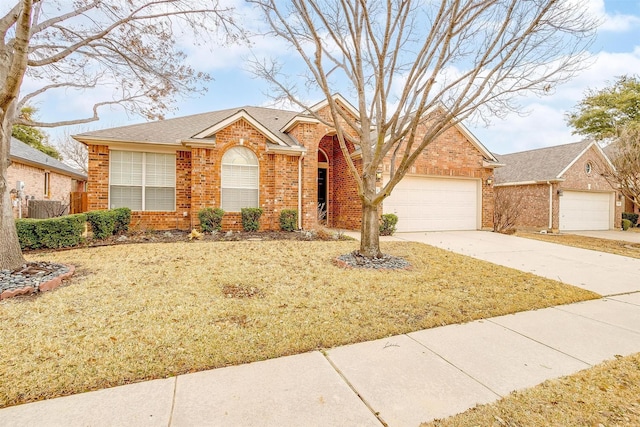 ranch-style house with a garage, brick siding, a shingled roof, concrete driveway, and a front yard