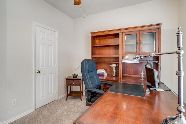 home office featuring carpet floors, baseboards, and a ceiling fan