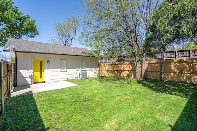 view of yard with a fenced backyard, cooling unit, and a patio