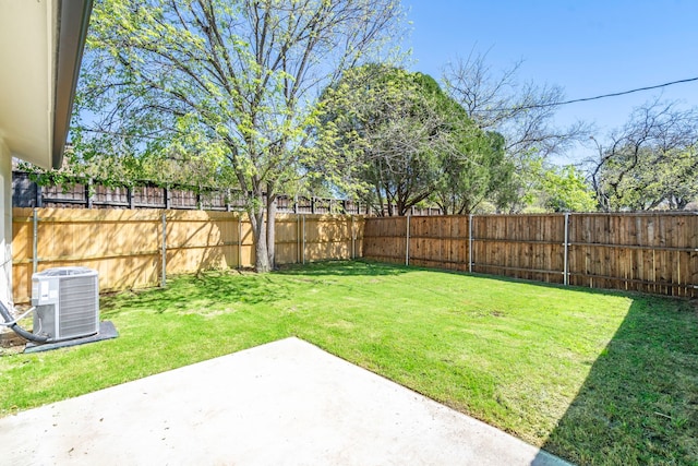 view of yard featuring a patio, a fenced backyard, and central air condition unit