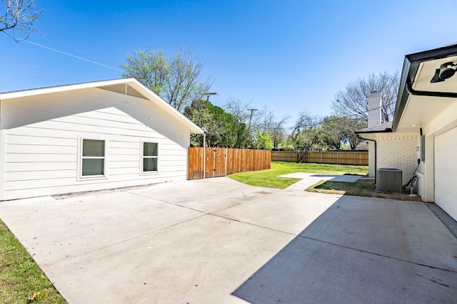 view of patio / terrace featuring fence and cooling unit