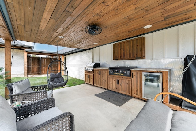 view of patio / terrace with a grill, fence, area for grilling, and an outdoor hangout area