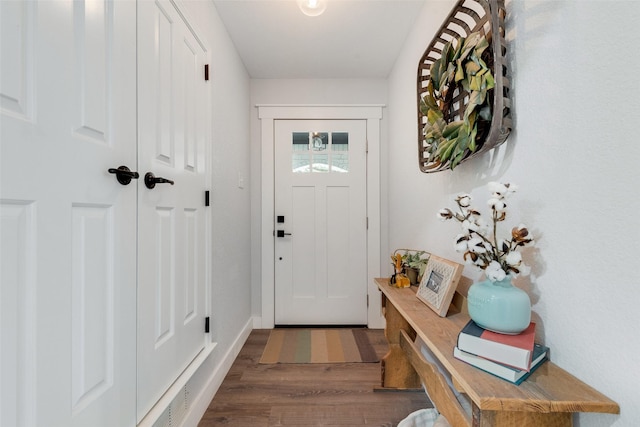 doorway to outside with wood finished floors