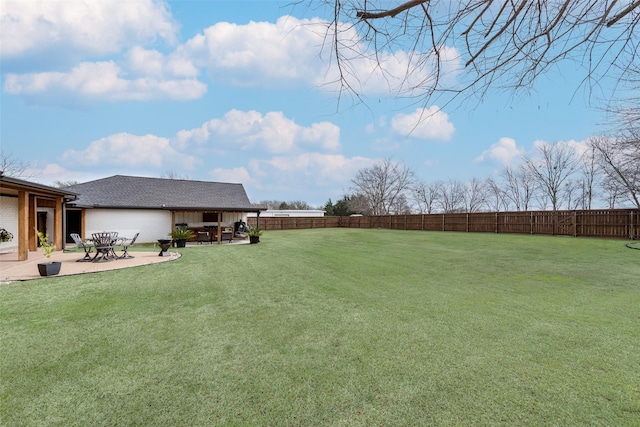 view of yard with a fenced backyard and a patio