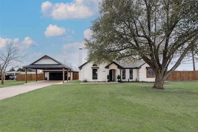 view of front of home featuring a carport, a front lawn, a chimney, and fence