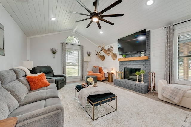 living area with a fireplace, vaulted ceiling with beams, recessed lighting, a ceiling fan, and wood ceiling