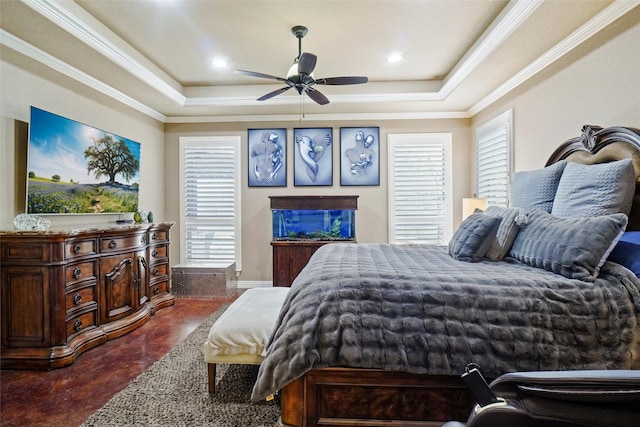 bedroom with concrete floors, ornamental molding, a raised ceiling, and recessed lighting