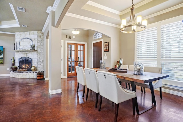 dining area featuring baseboards, visible vents, a raised ceiling, and french doors