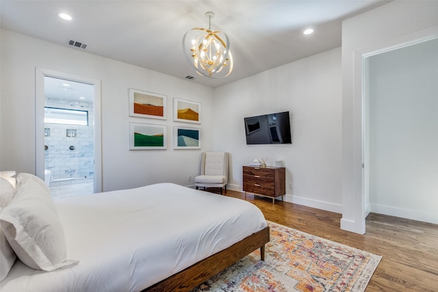 bedroom featuring a notable chandelier, recessed lighting, visible vents, wood finished floors, and baseboards