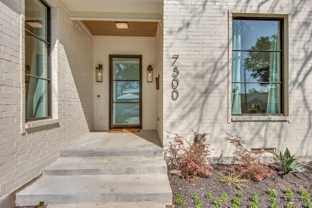 entrance to property with brick siding