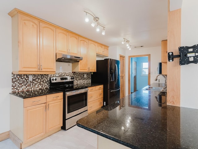 kitchen with electric stove, black fridge, light brown cabinetry, under cabinet range hood, and a sink