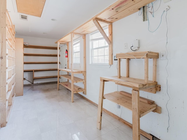 storage area featuring visible vents and attic access