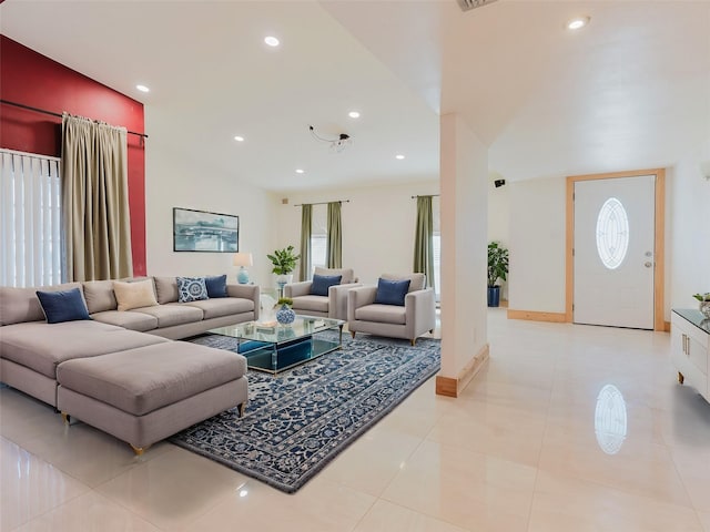 living room with baseboards, light tile patterned flooring, visible vents, and recessed lighting