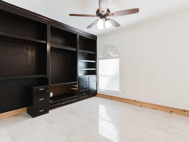 unfurnished bedroom with ceiling fan, ornamental molding, and baseboards