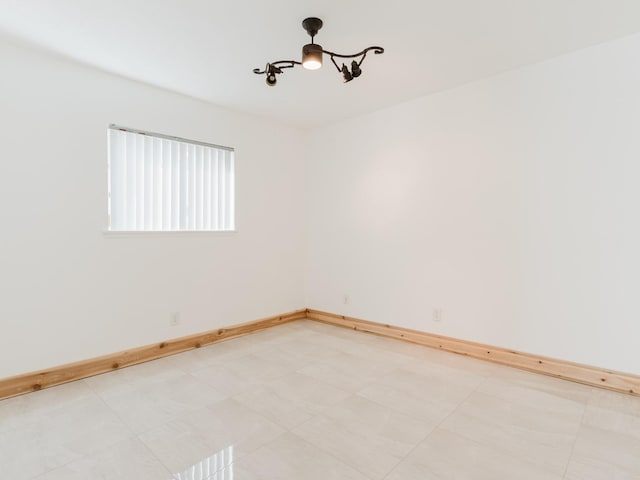 empty room featuring baseboards