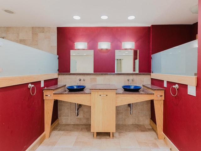 full bath featuring recessed lighting and a sink