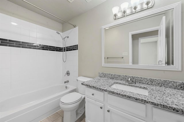 full bath with toilet, tile patterned floors,  shower combination, and vanity