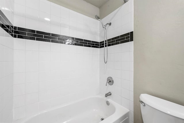 full bathroom featuring washtub / shower combination and toilet