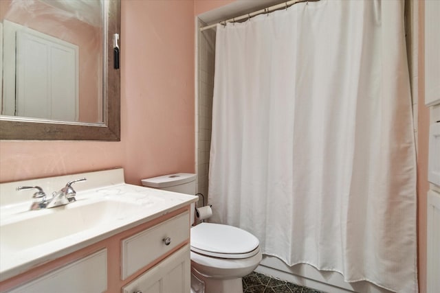 bathroom with toilet and vanity