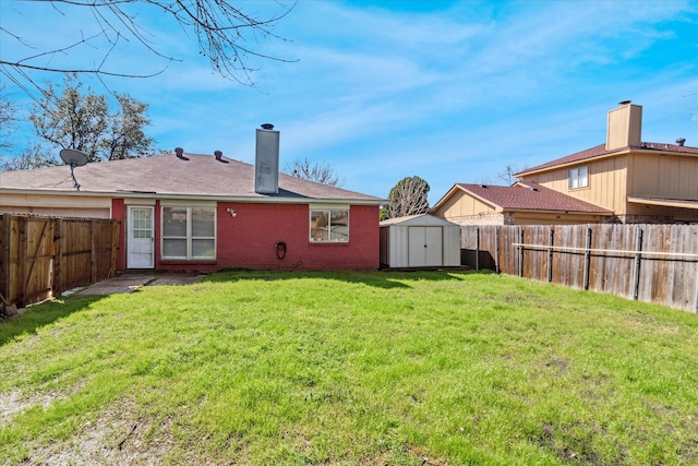 back of house with brick siding, a yard, a chimney, a storage unit, and a fenced backyard