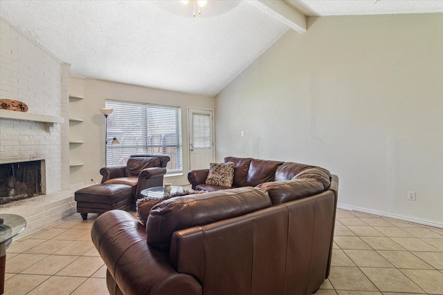 living area featuring built in shelves, a brick fireplace, a textured ceiling, and light tile patterned floors