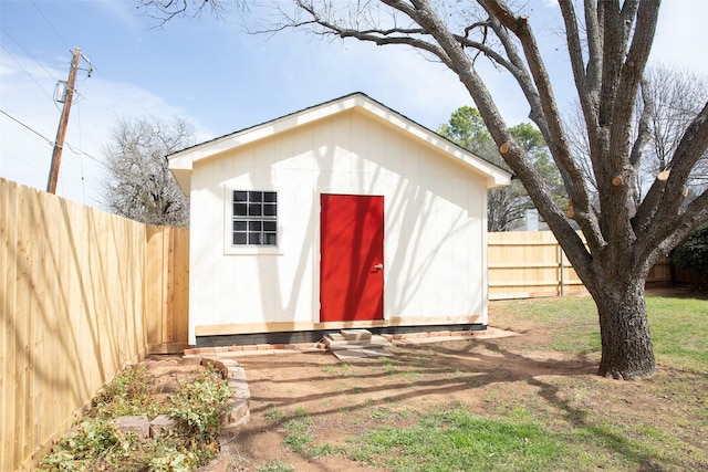 view of shed with a fenced backyard