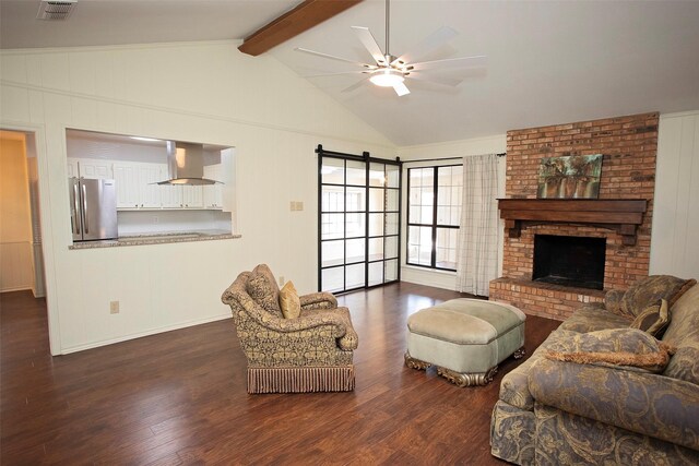 living room with dark wood-style flooring, a fireplace, vaulted ceiling with beams, visible vents, and a ceiling fan