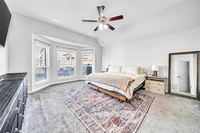 bedroom with light carpet, vaulted ceiling, visible vents, and baseboards