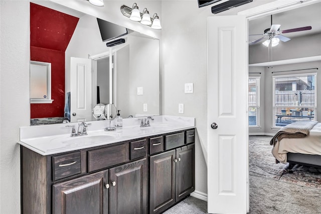 full bathroom featuring a ceiling fan, connected bathroom, a sink, and double vanity