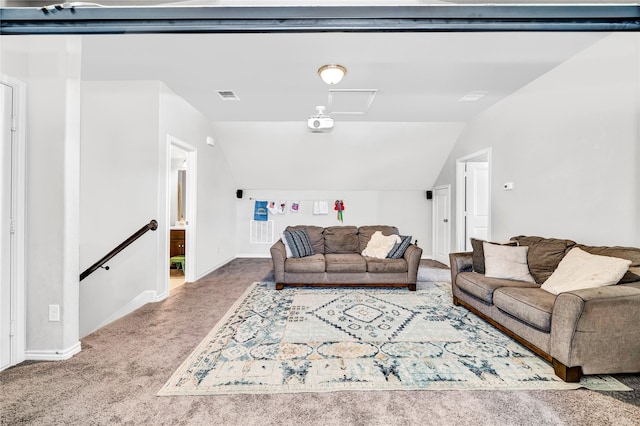 carpeted living area with lofted ceiling, visible vents, and baseboards