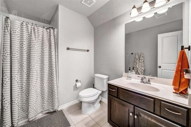 bathroom with tile patterned flooring, visible vents, vanity, and toilet